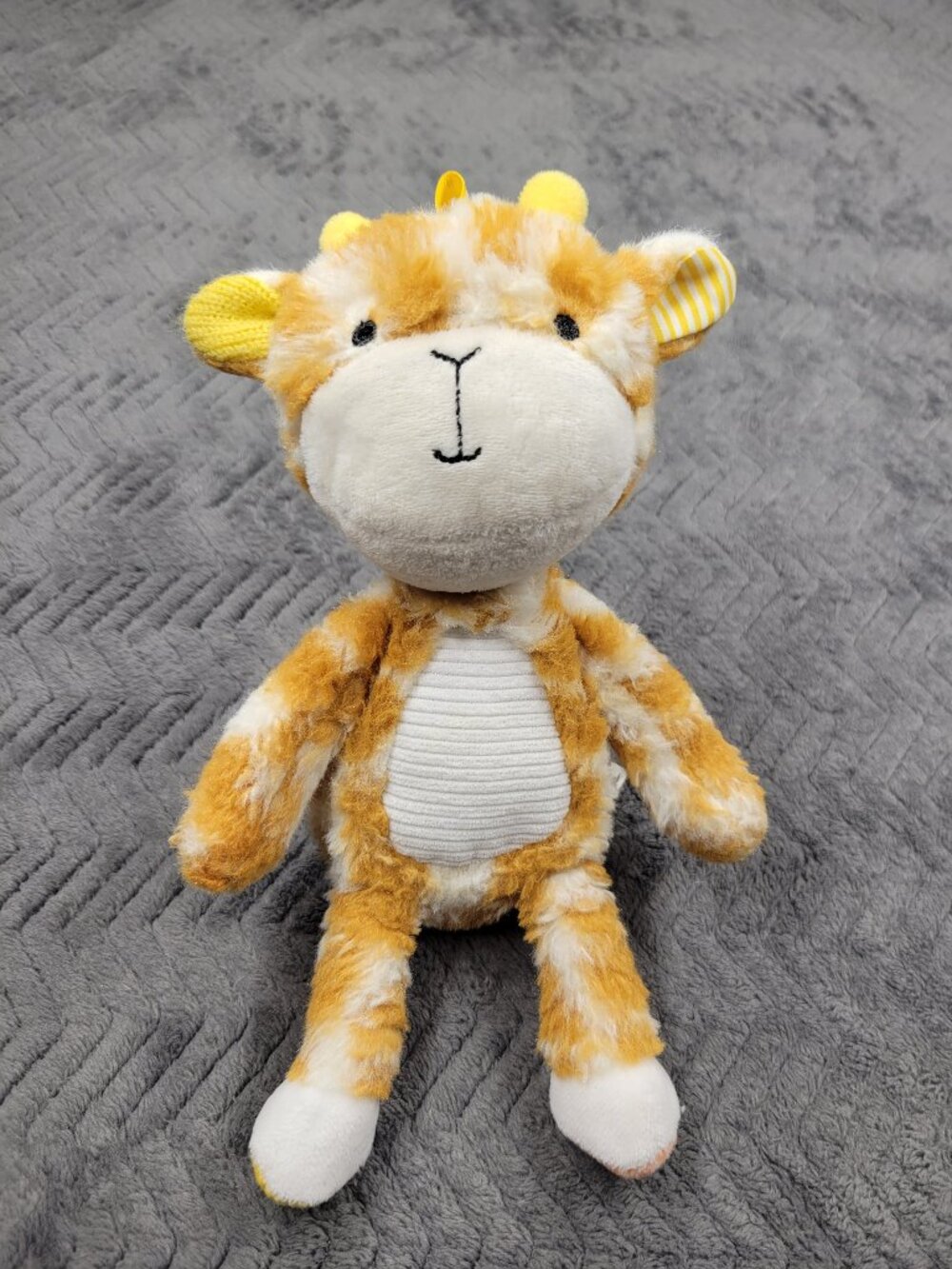 Plush giraffe Make Believe Ideas Size 10 inches Orange and white Good condition